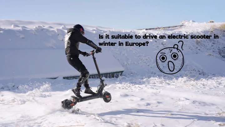 A small, compact Kukirin vehicle driving on a snowy winter road